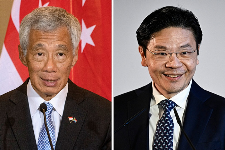 นายลี เซียนลุง นายกรัฐมนตรีสิงคโปร์ (ซ้าย) นายลอว์เรนซ์ หว่อง ว่าที่นายกรัฐมนตรีคนใหม่ของสิงคโปร์ (Photo : AFP)
